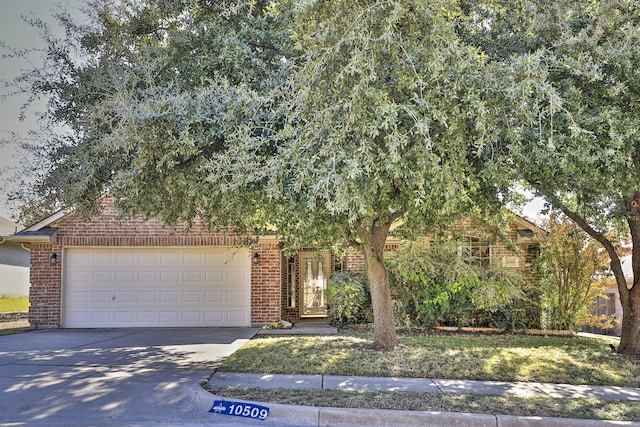 obstructed view of property with a garage