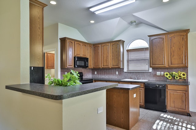 kitchen with backsplash, kitchen peninsula, vaulted ceiling, light tile patterned flooring, and black appliances