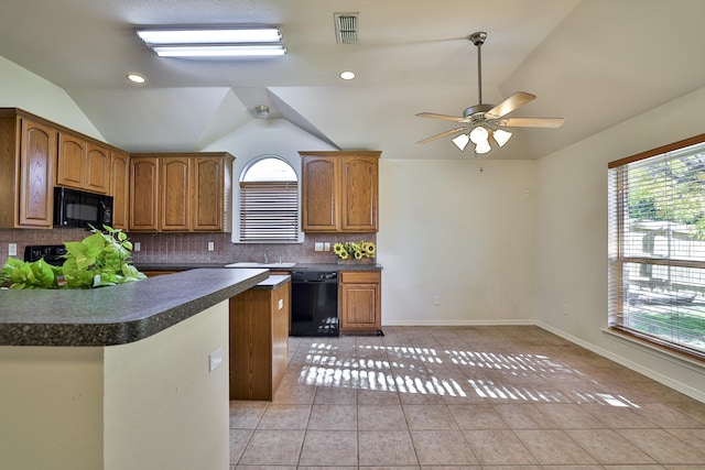 kitchen with black appliances, lofted ceiling, backsplash, and light tile patterned floors