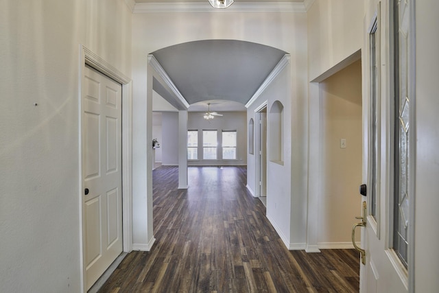 corridor with dark hardwood / wood-style floors and lofted ceiling