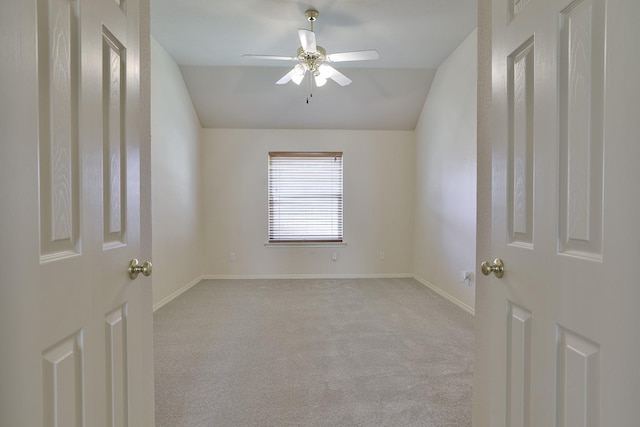 unfurnished room featuring ceiling fan and light colored carpet