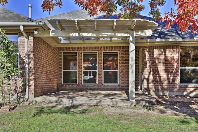 back of house featuring a pergola and a patio area