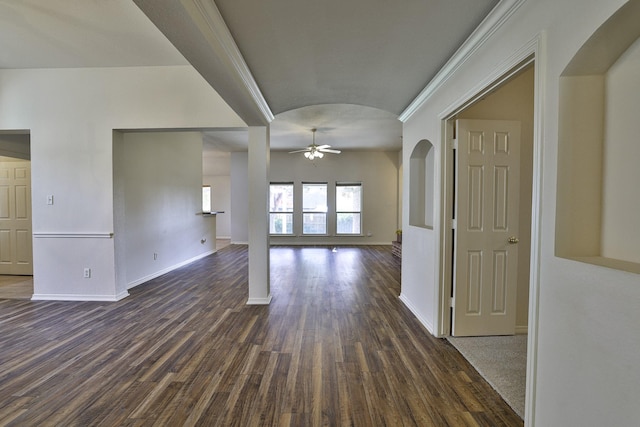 unfurnished living room with ceiling fan, dark hardwood / wood-style flooring, and ornamental molding