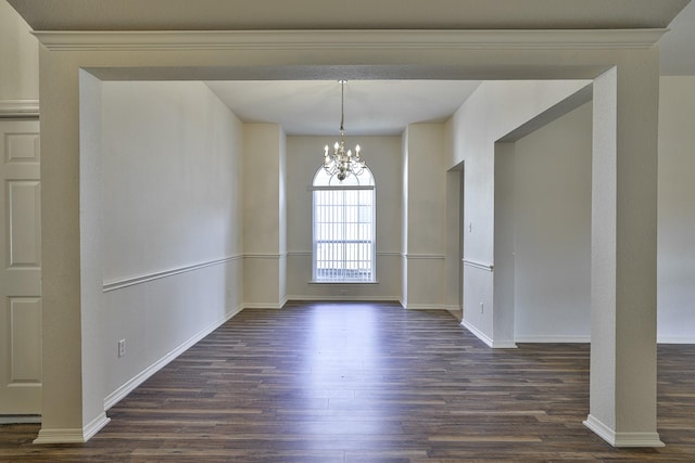 unfurnished dining area featuring dark hardwood / wood-style floors and a chandelier