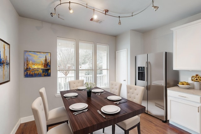 dining room with dark wood-type flooring