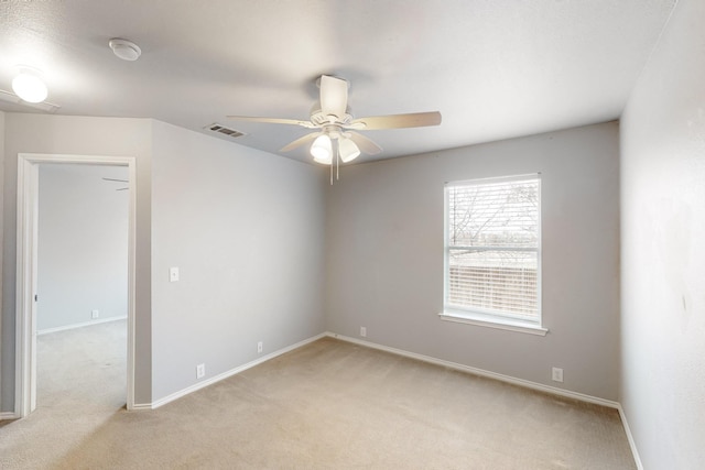 carpeted empty room with ceiling fan