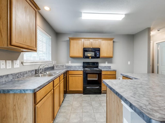 kitchen featuring black appliances and sink