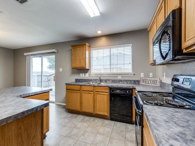 kitchen featuring black appliances and sink