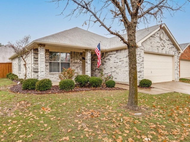 ranch-style house with a garage and a front lawn