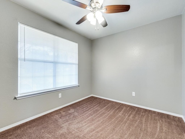 carpeted empty room with ceiling fan