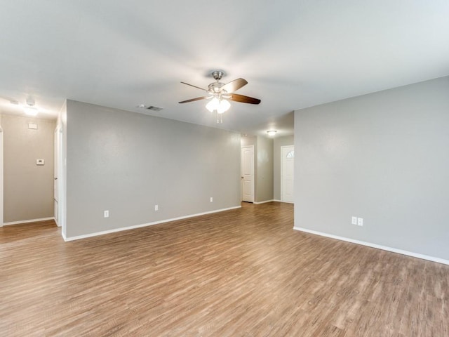 spare room with ceiling fan and light hardwood / wood-style flooring