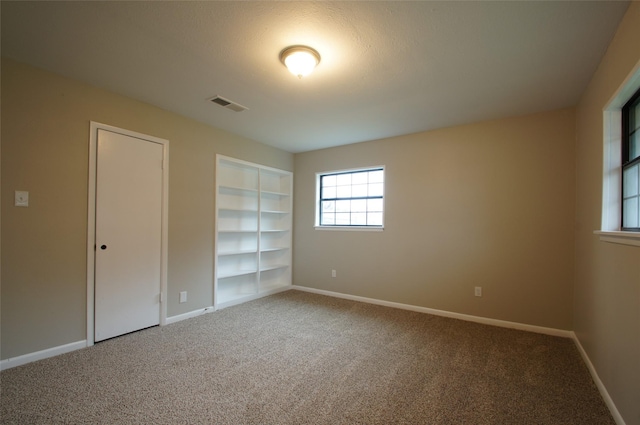 unfurnished bedroom featuring carpet floors