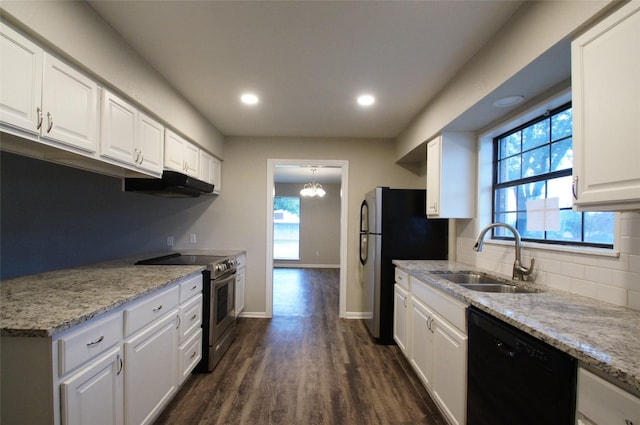 kitchen with white cabinets, sink, light stone counters, dark hardwood / wood-style flooring, and stainless steel appliances