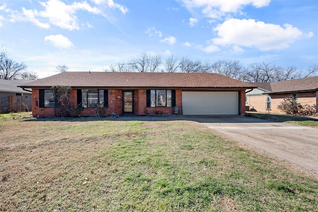 ranch-style home featuring a garage and a front lawn