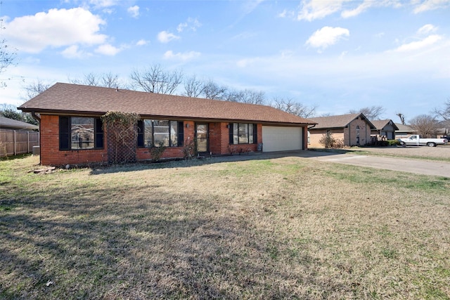 single story home featuring a garage and a front lawn