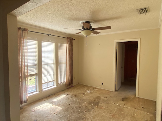 empty room featuring ceiling fan, crown molding, and a textured ceiling