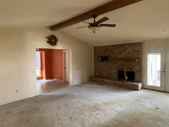 unfurnished living room featuring lofted ceiling with beams, ceiling fan, and a brick fireplace