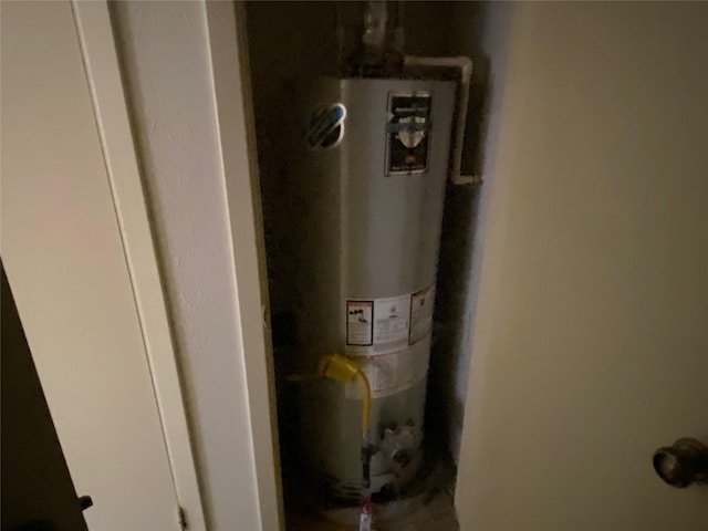 utility room featuring gas water heater