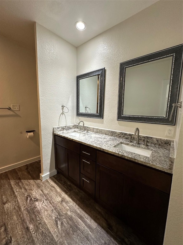 bathroom with vanity and hardwood / wood-style floors