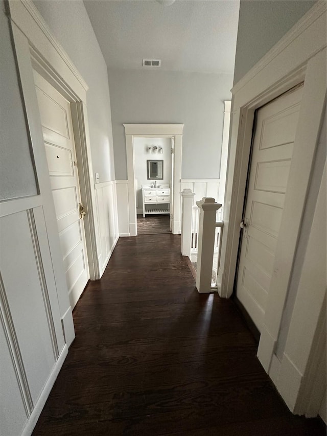 hallway featuring dark hardwood / wood-style floors