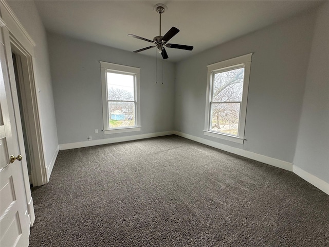 carpeted empty room featuring ceiling fan