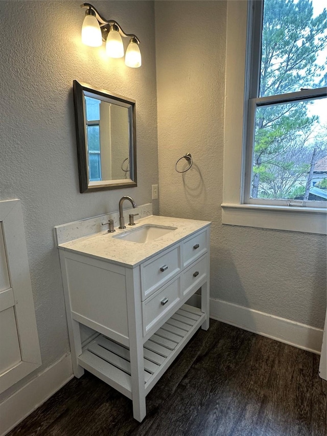 bathroom featuring vanity and hardwood / wood-style floors