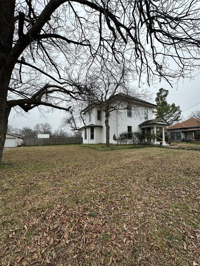 back of house featuring central AC unit and covered porch