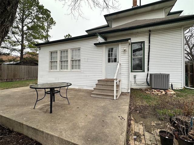 rear view of property with a patio and central air condition unit