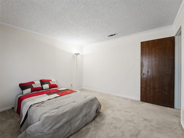 carpeted bedroom with a textured ceiling and ornamental molding