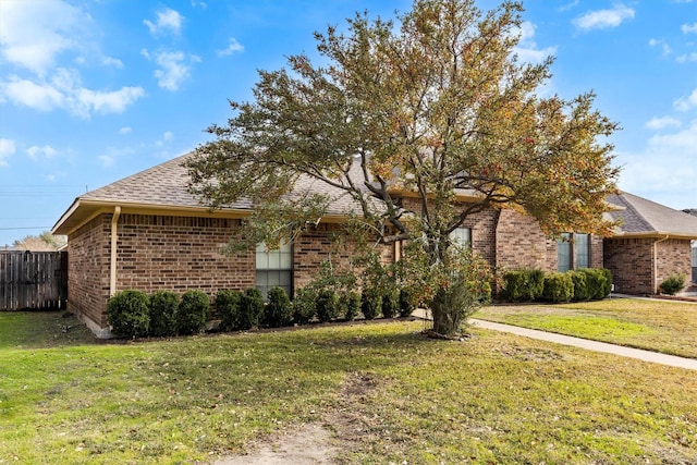 view of front of home with a front lawn