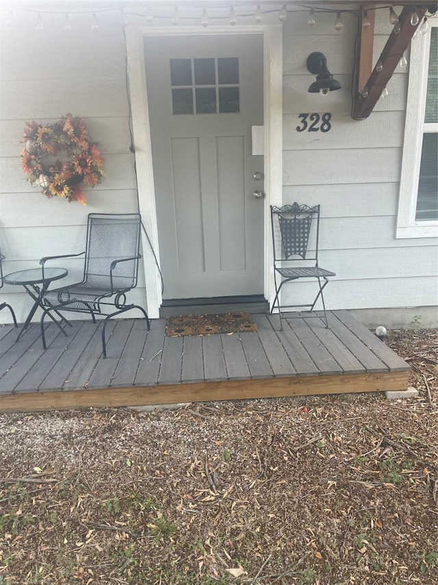 doorway to property featuring a wooden deck