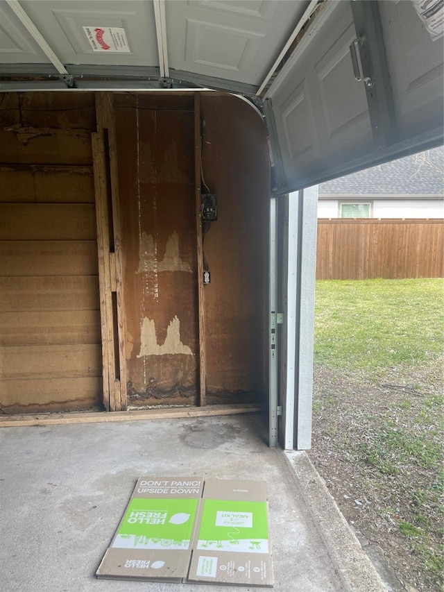 garage with fence