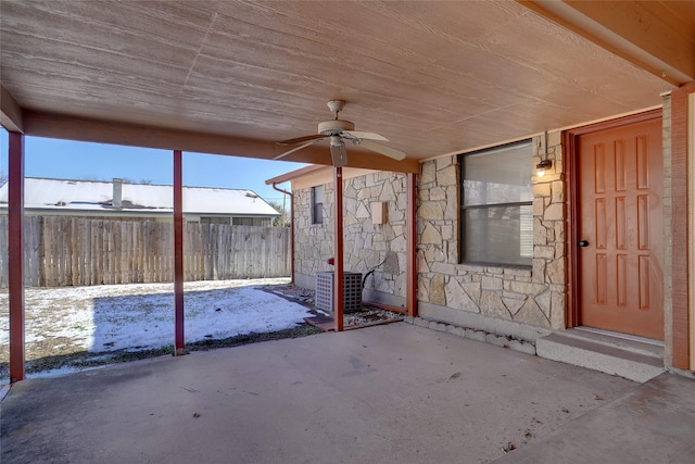 snow covered patio with ceiling fan and central air condition unit