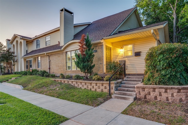 view of front of house with a lawn