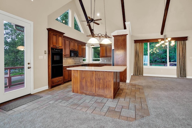 kitchen featuring a center island, high vaulted ceiling, backsplash, pendant lighting, and black appliances