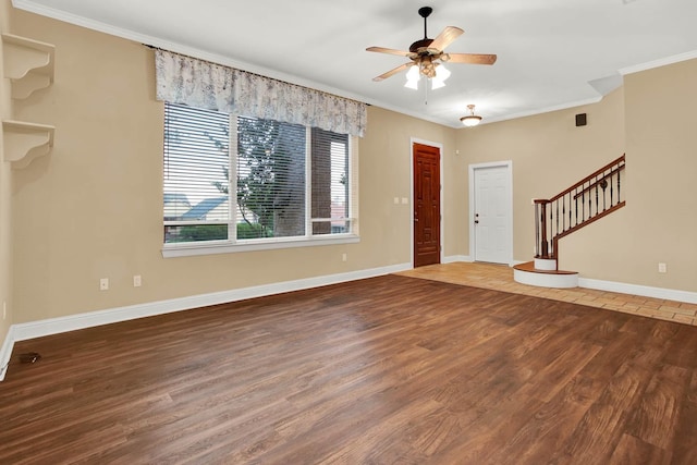 foyer with wood-type flooring, ceiling fan, and ornamental molding