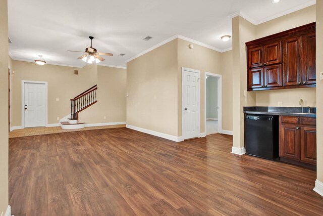 kitchen with dishwasher, dark wood-type flooring, crown molding, sink, and ceiling fan