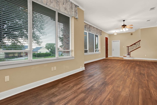 spare room with ceiling fan, crown molding, and hardwood / wood-style flooring