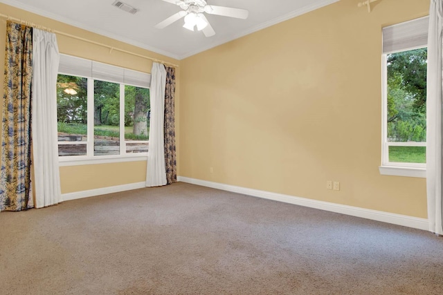 carpeted empty room featuring ceiling fan and ornamental molding