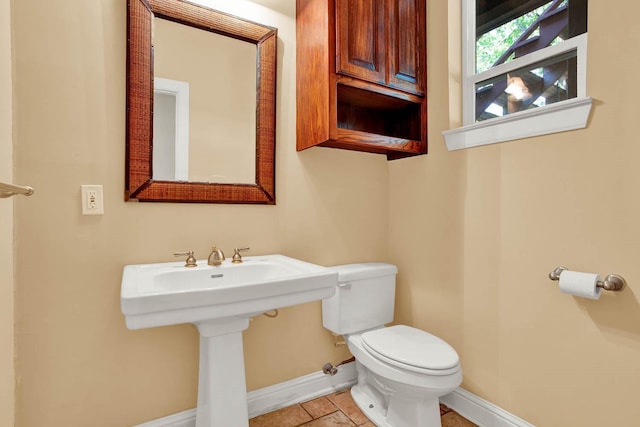 bathroom featuring tile patterned floors, sink, and toilet