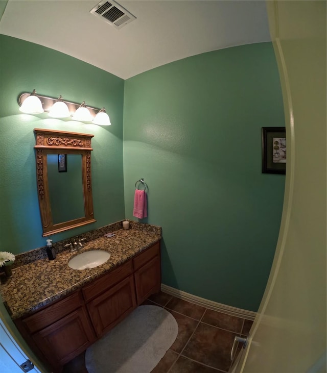 bathroom with tile patterned floors and vanity