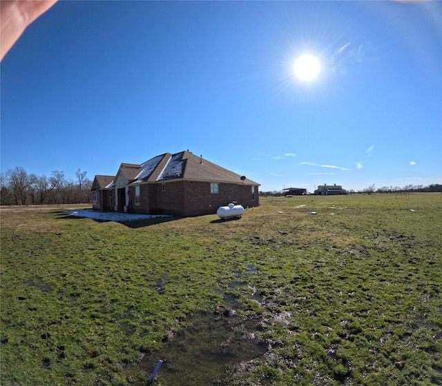 view of yard with a patio and a rural view