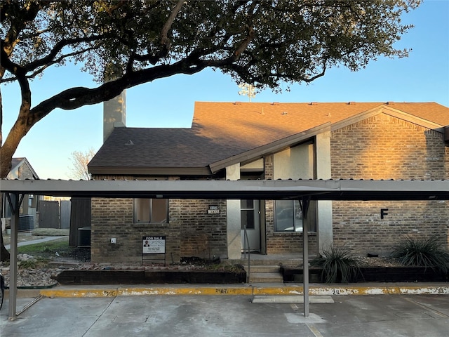 exterior space featuring a carport