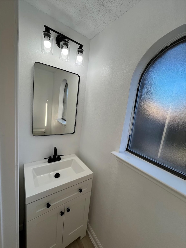 bathroom featuring vanity and a textured ceiling