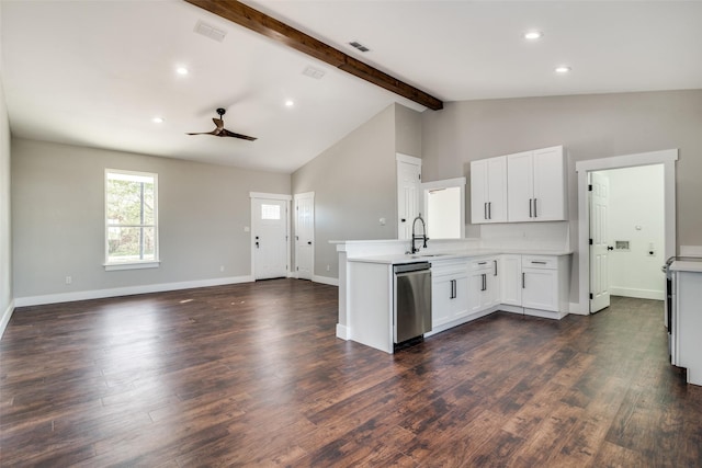 kitchen with ceiling fan, beamed ceiling, white cabinets, and stainless steel dishwasher