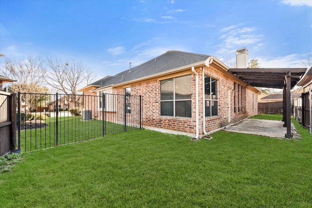 back of house featuring a yard and a patio area