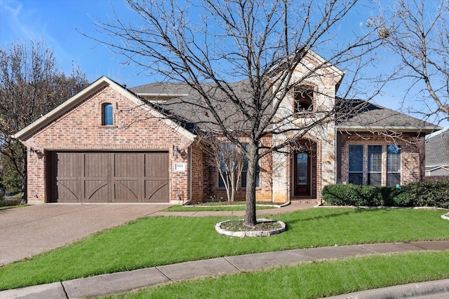 view of front facade with a garage and a front yard