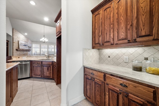 kitchen featuring a chandelier, light stone countertops, light tile patterned floors, stainless steel dishwasher, and backsplash