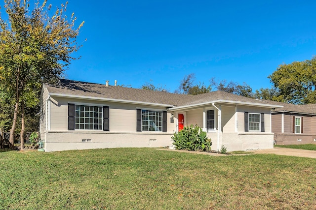 ranch-style house featuring a front lawn