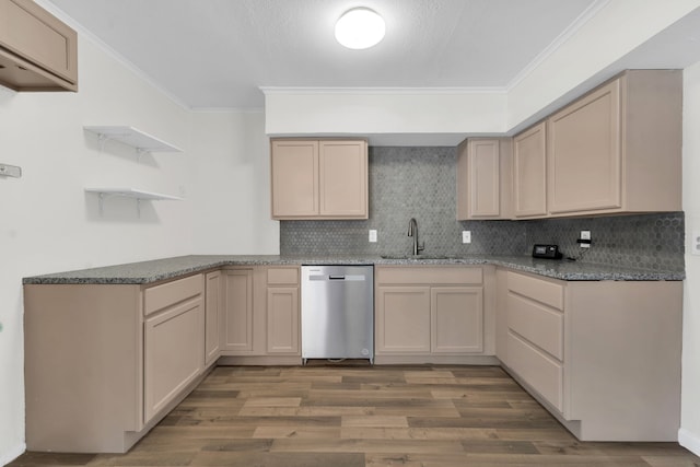 kitchen featuring dishwasher, light brown cabinetry, tasteful backsplash, and sink